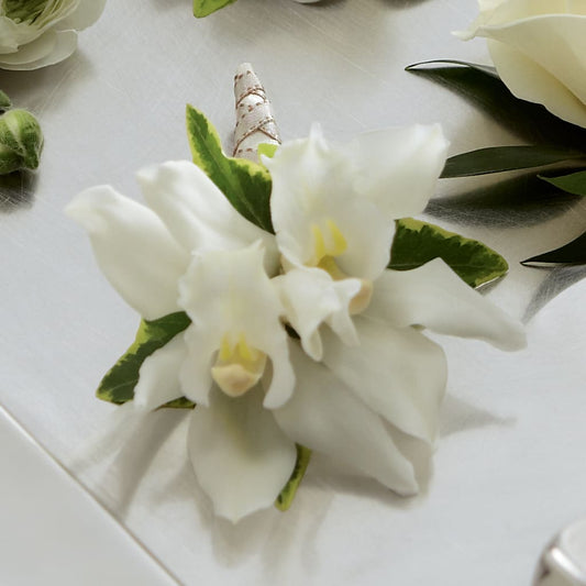 White Mini Cymbidium Boutonniere –  Batavia Stage Coach Florist, Batavia NY